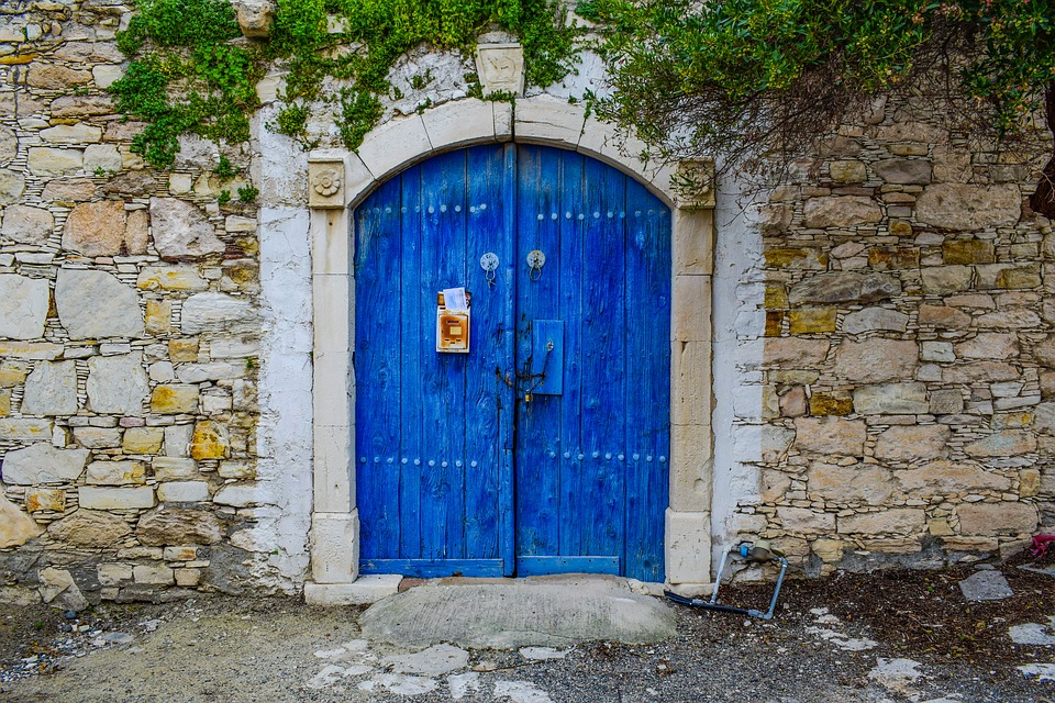 Old wooden door painted in blue 