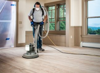 man working on the best floor buffer for home use