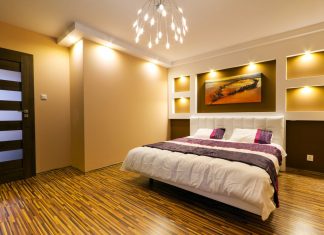 room with large bed and semi dark lighting