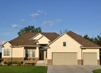 front of a house in tan color